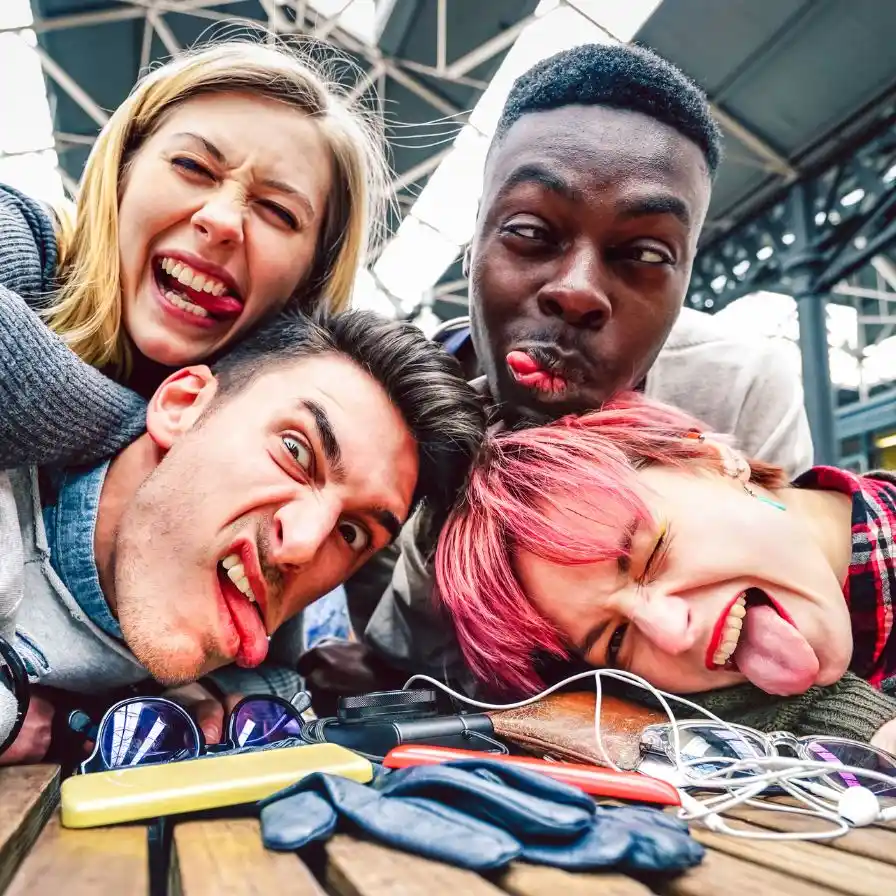 a-group-of-people-sitting-on-a-wooden-bench